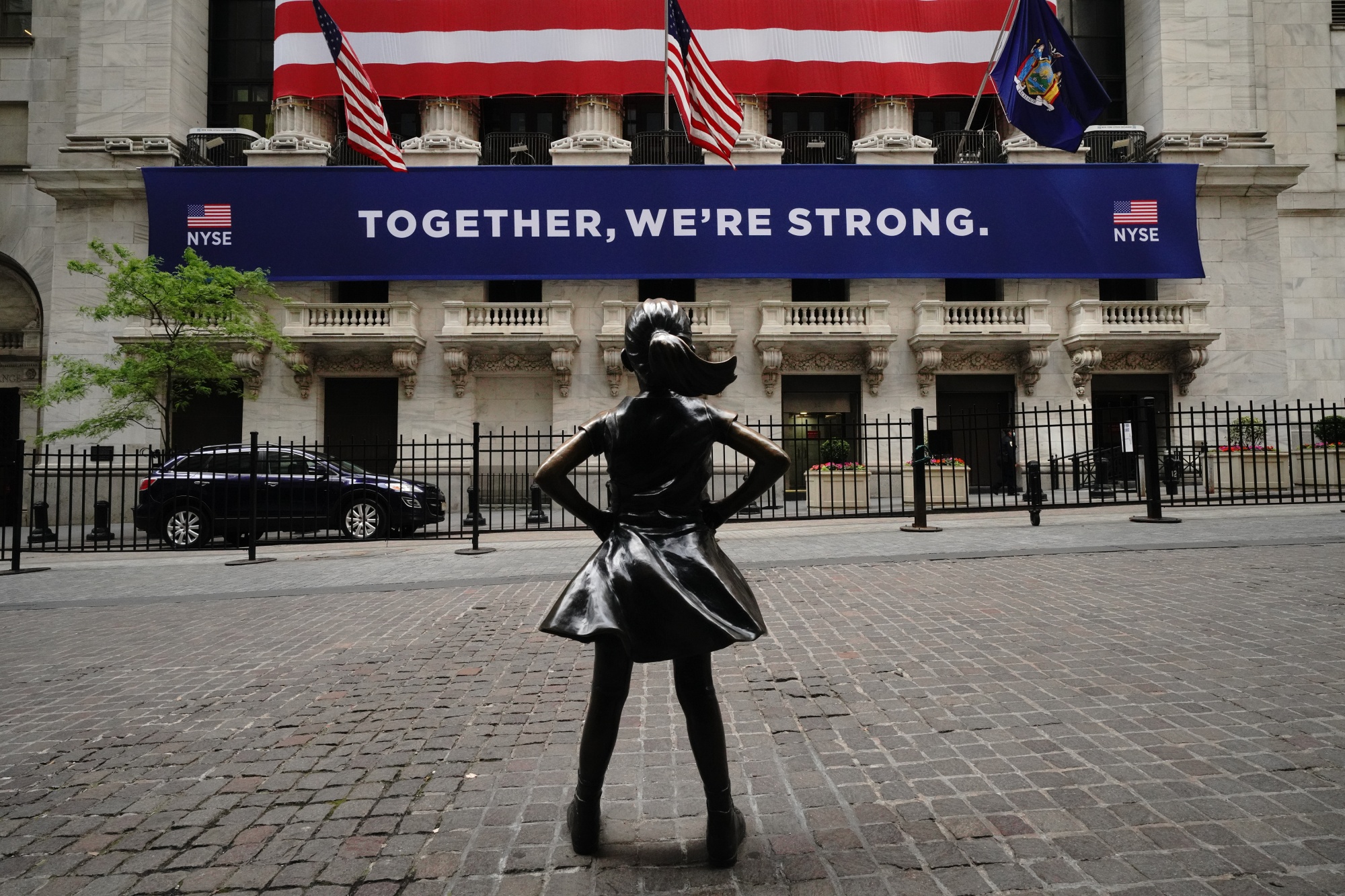 Fearless girl in front of the New York Stock Exchange during the