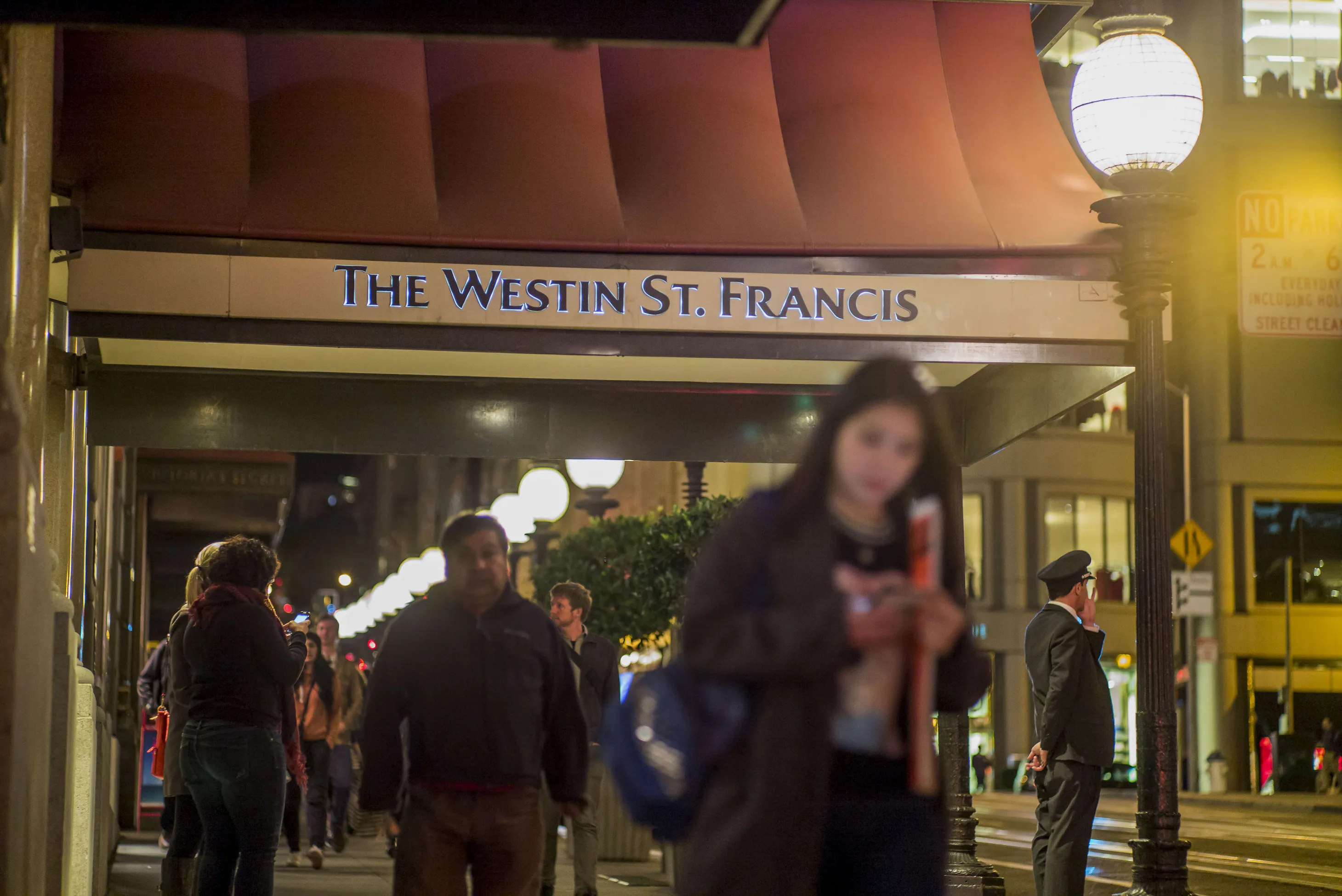 Pedestrians walk past the Westin St. Francis hotel in San Francisco.