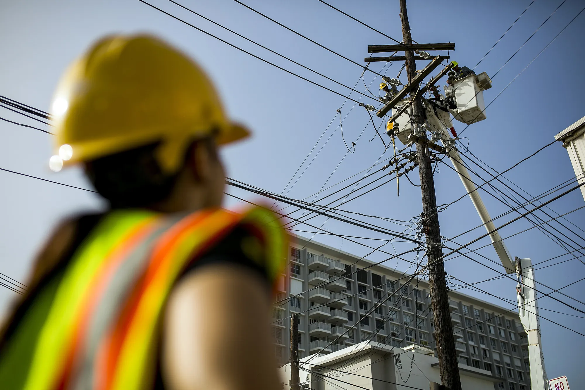 Puerto Rico Electric Power Authority employees fix power lines in Santurce, San Juan on Oct. 19, 2017.
