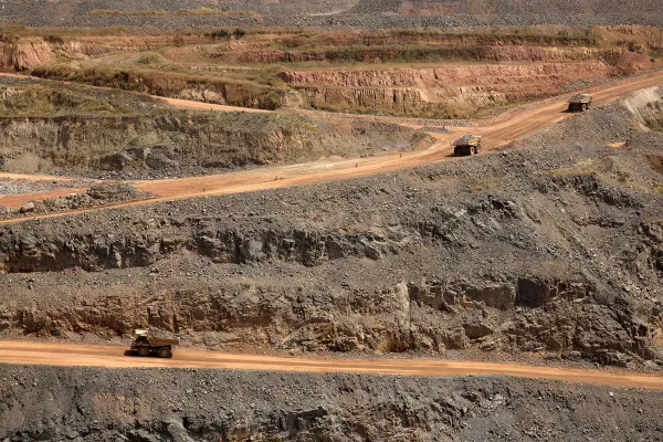 Dumper trucks collect rock ore at the Gounkoto gold mine in Mali.