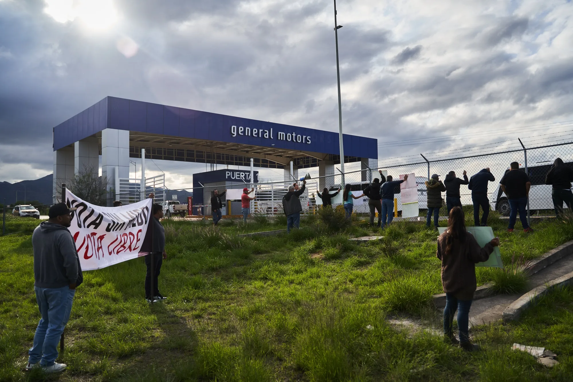 Auto workers and union members participate in a rally ahead of a unionization vote outside of the General Motors assembly plant in San Luis Potosi, Mexico, on June 26.