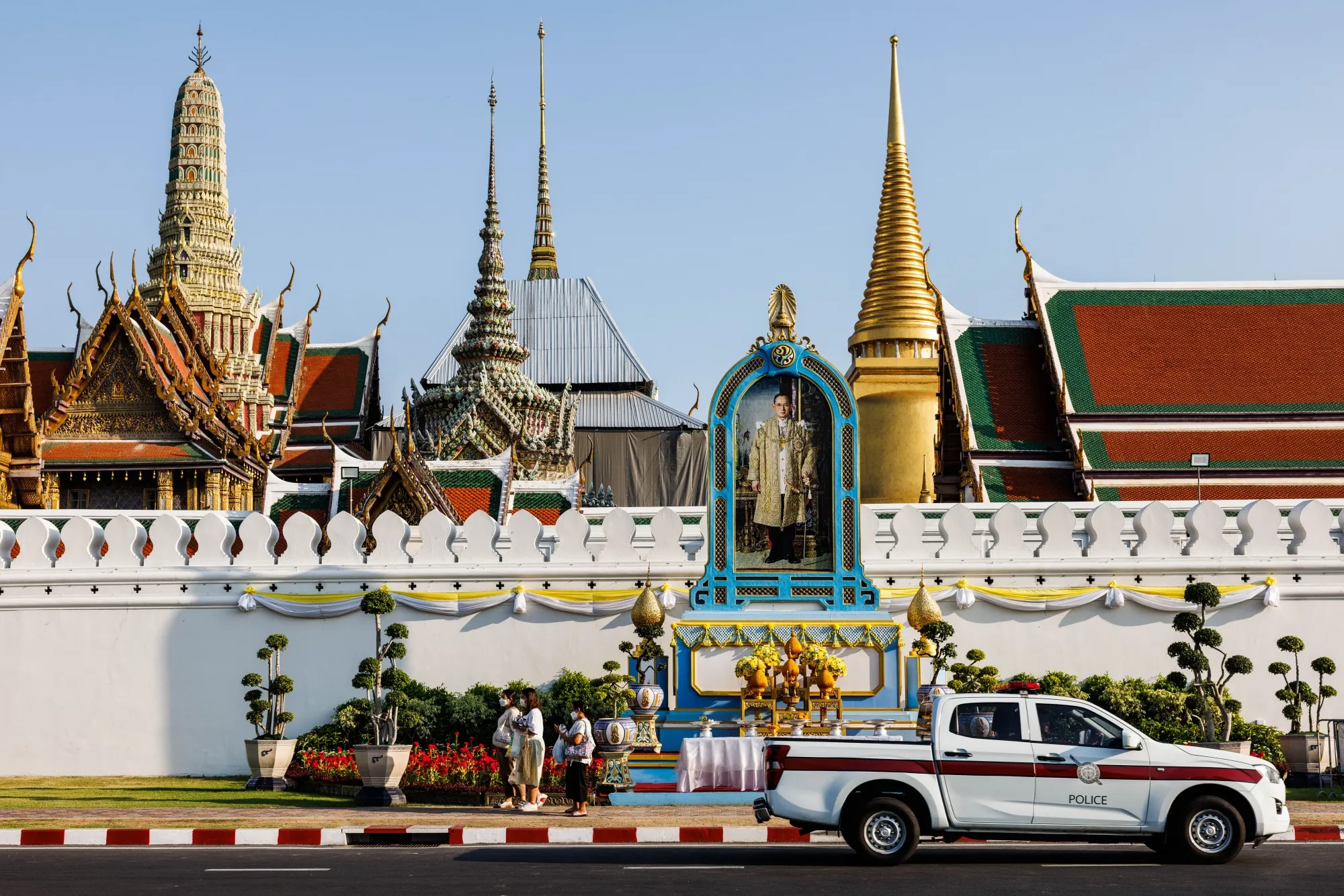 A portrait of Thailand’s King Bhumibol Adulyadej sits in front of the Grand Palace in Bangkok on May 6. His reign saw major economic development, but the nation’s competitiveness faded soon before he died in 2016.
