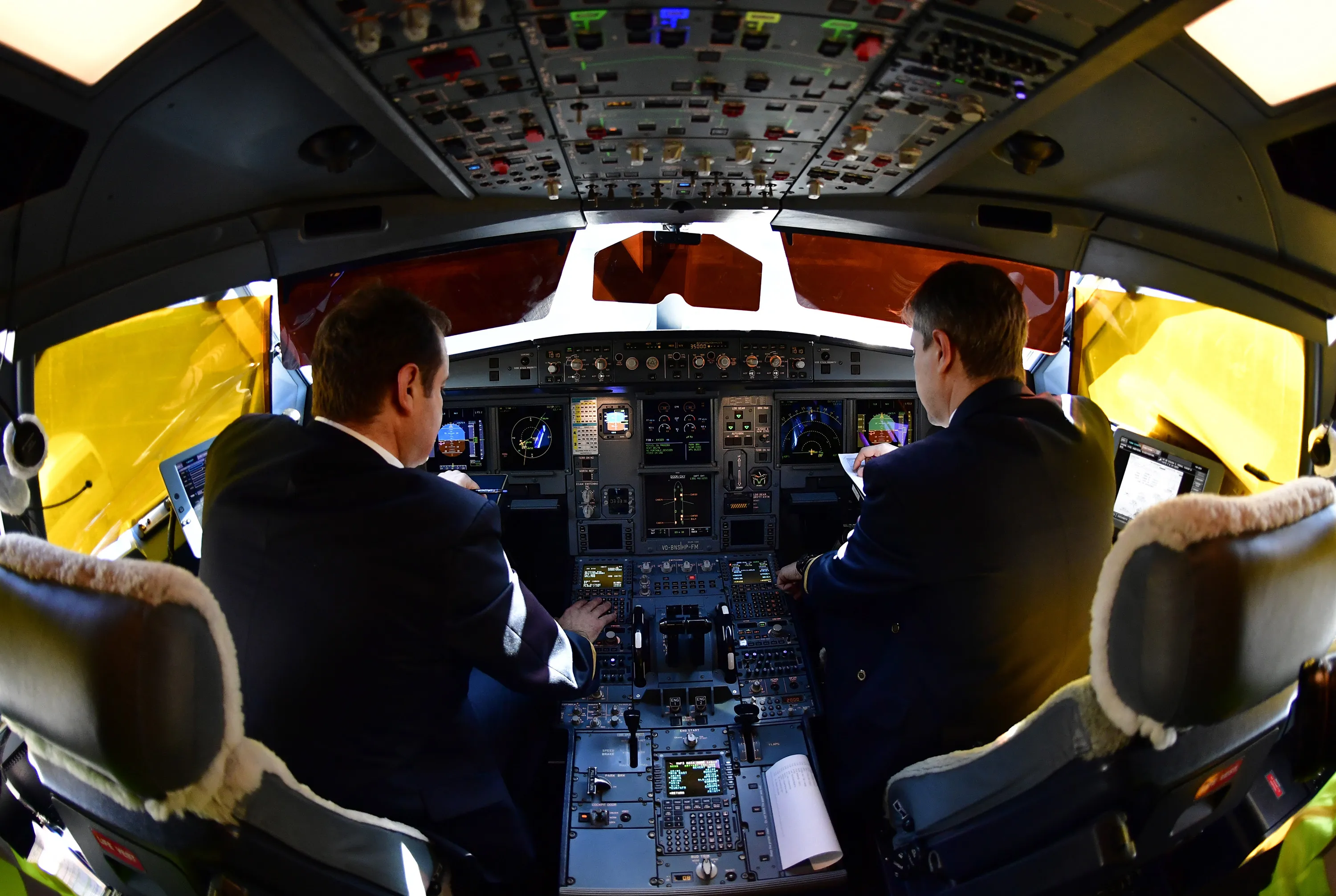 Pilots in the cockpit of an Aeroflot passenger aircraft.