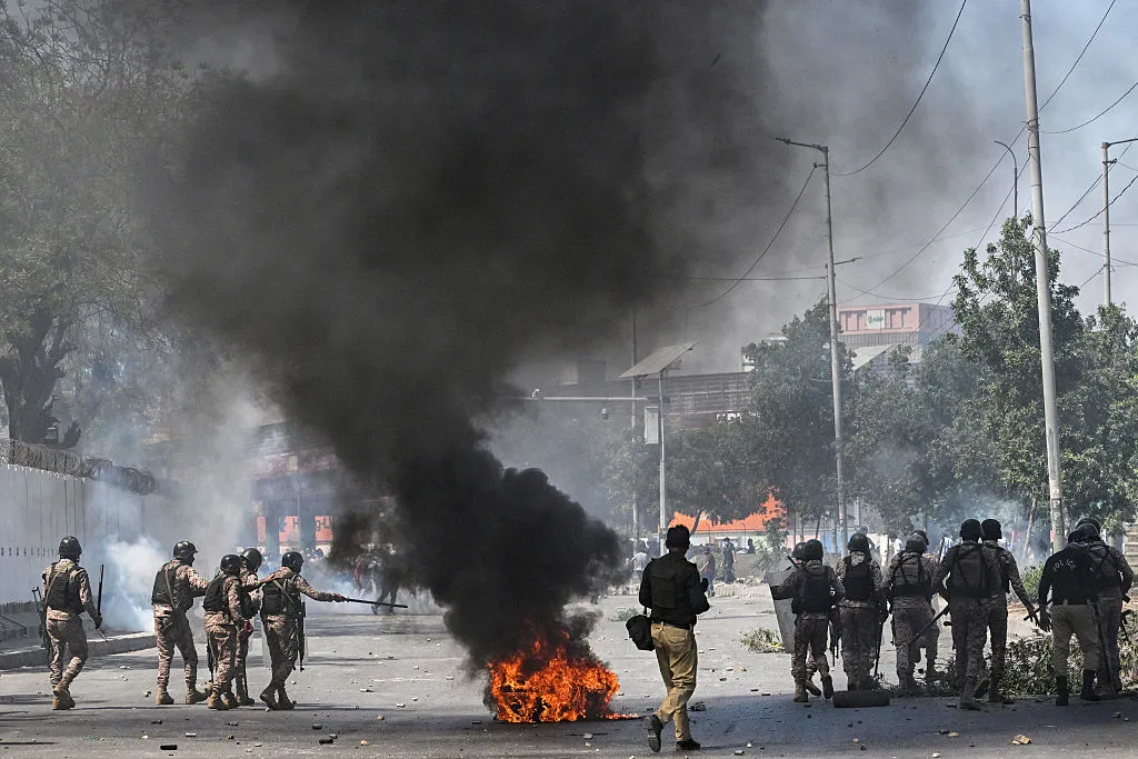 Security personnel fire tear gas at&nbsp;Shiite Muslims during a protest outside the US consulate in Karachi on March 1.