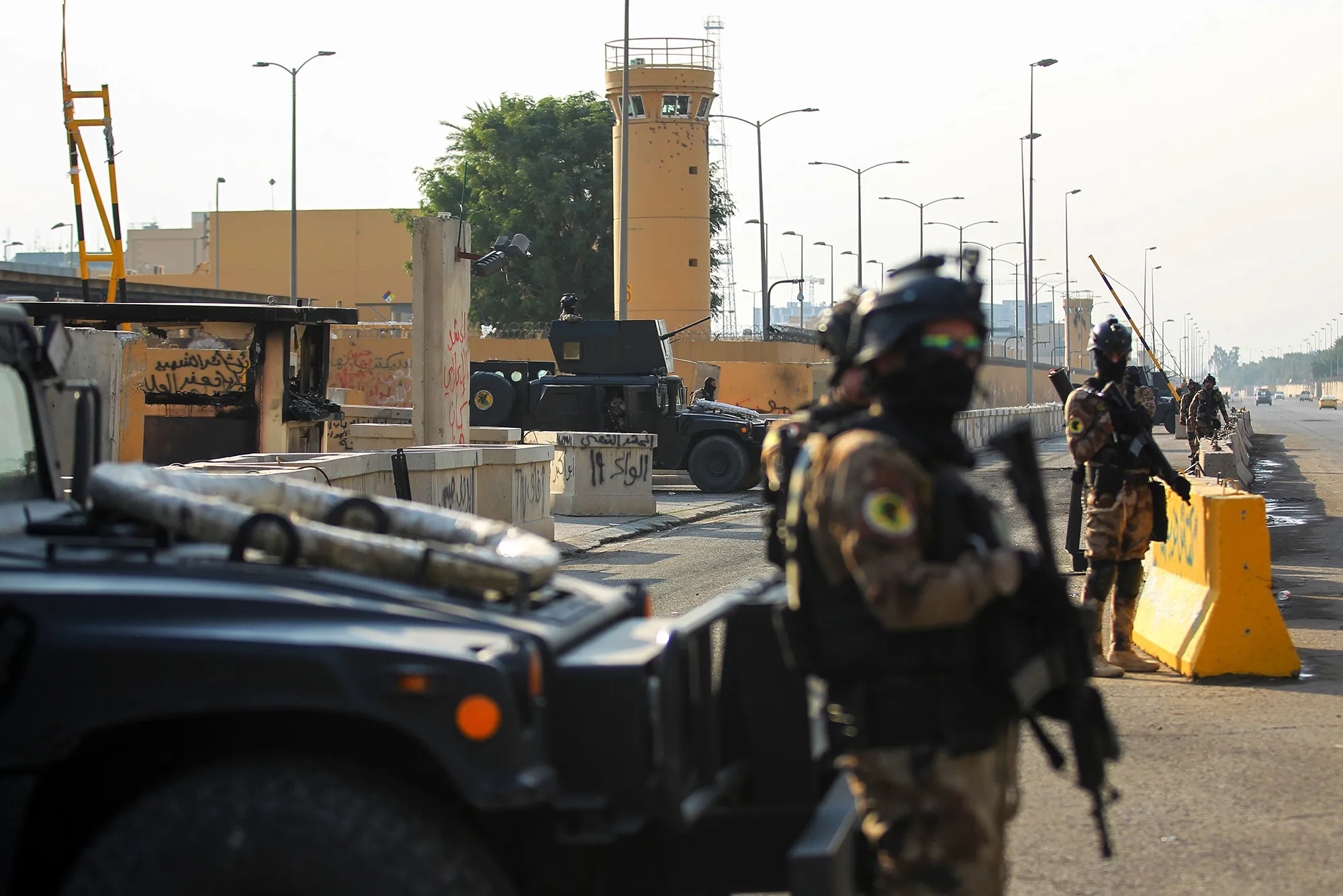 Iraqi counter-terrorism forces stand guard in front of the U.S. embassy in Baghdad on Jan.&nbsp;2.