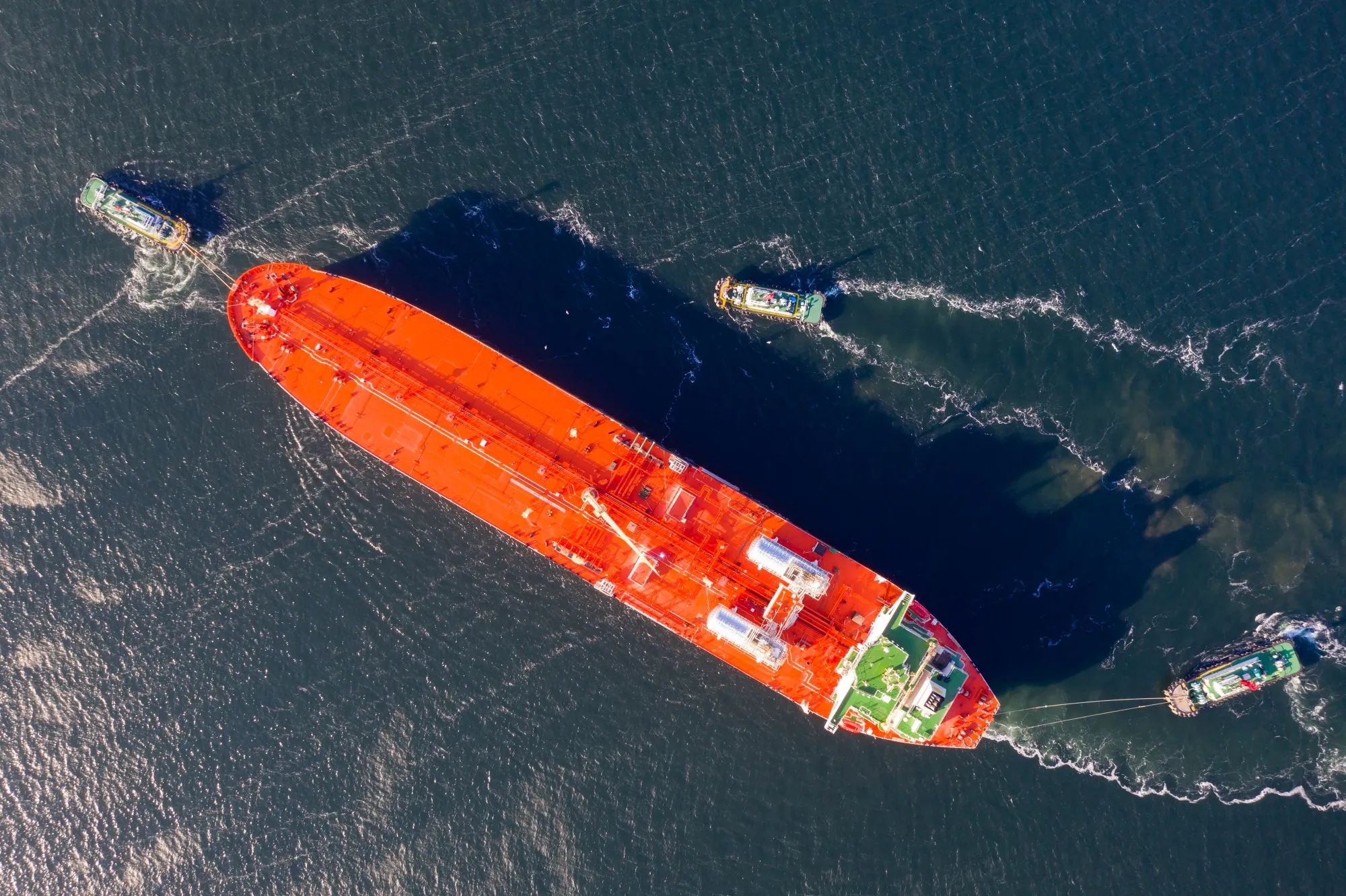 Tug boats tow an LNG&nbsp;ship.