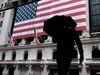 People walk in front of the New York Stock Exchange (NYSE) on March 17, 2020 in New York City.