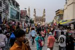 Shoppers walk through a market&nbsp;in Hyderabad, India.