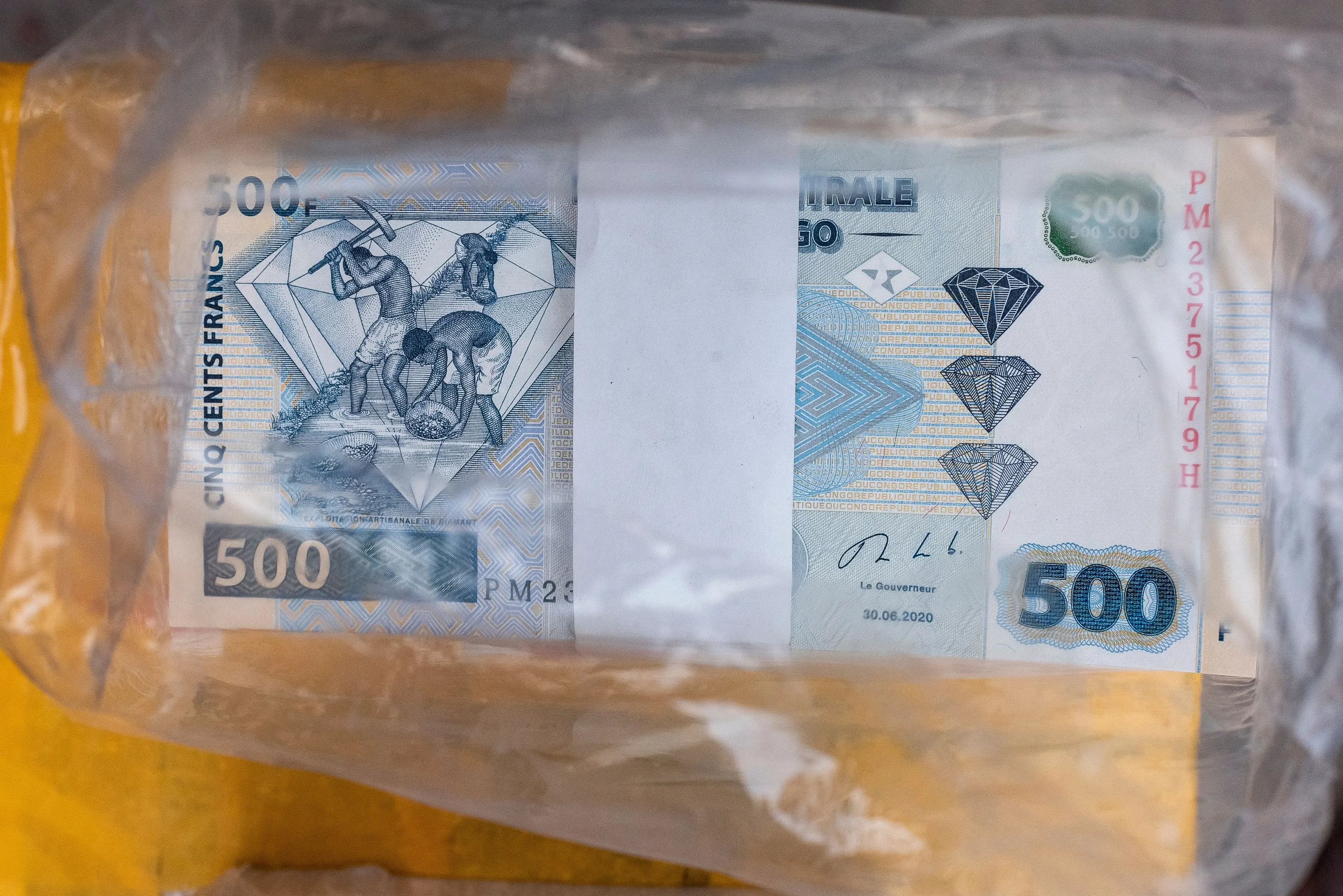 Congo’s franc notes wrapped in a currency trader’s cabin at a market in Kinshasa, Democratic Republic of Congo.