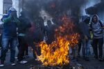 Demonstrators light a fire during a protest in the Historic Center neighborhood of Quito, Ecuador on Oct. 9.