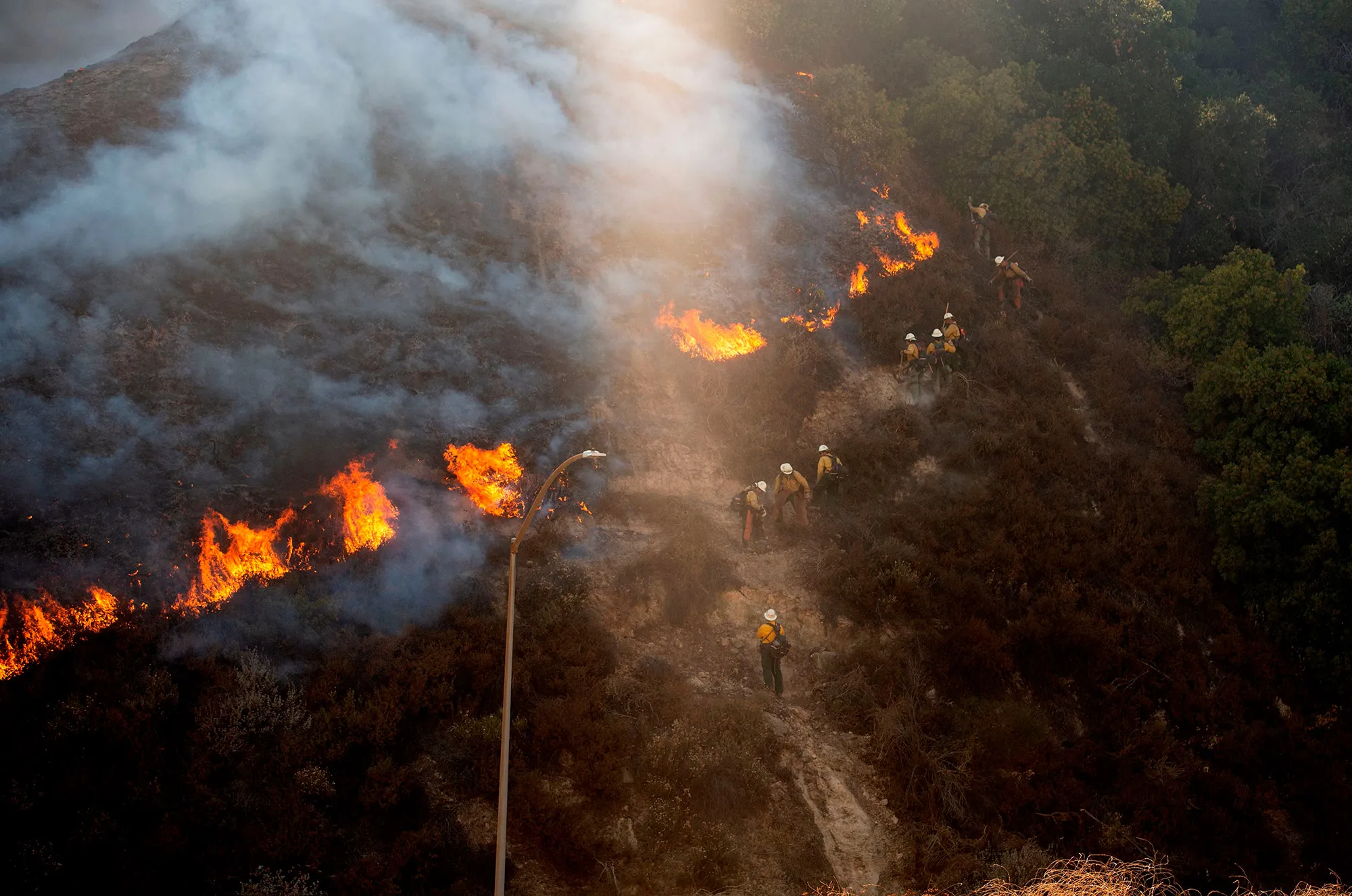 Firefighters fight&nbsp;a fire&nbsp;in Newhall, California on Oct.&nbsp;11.&nbsp;
