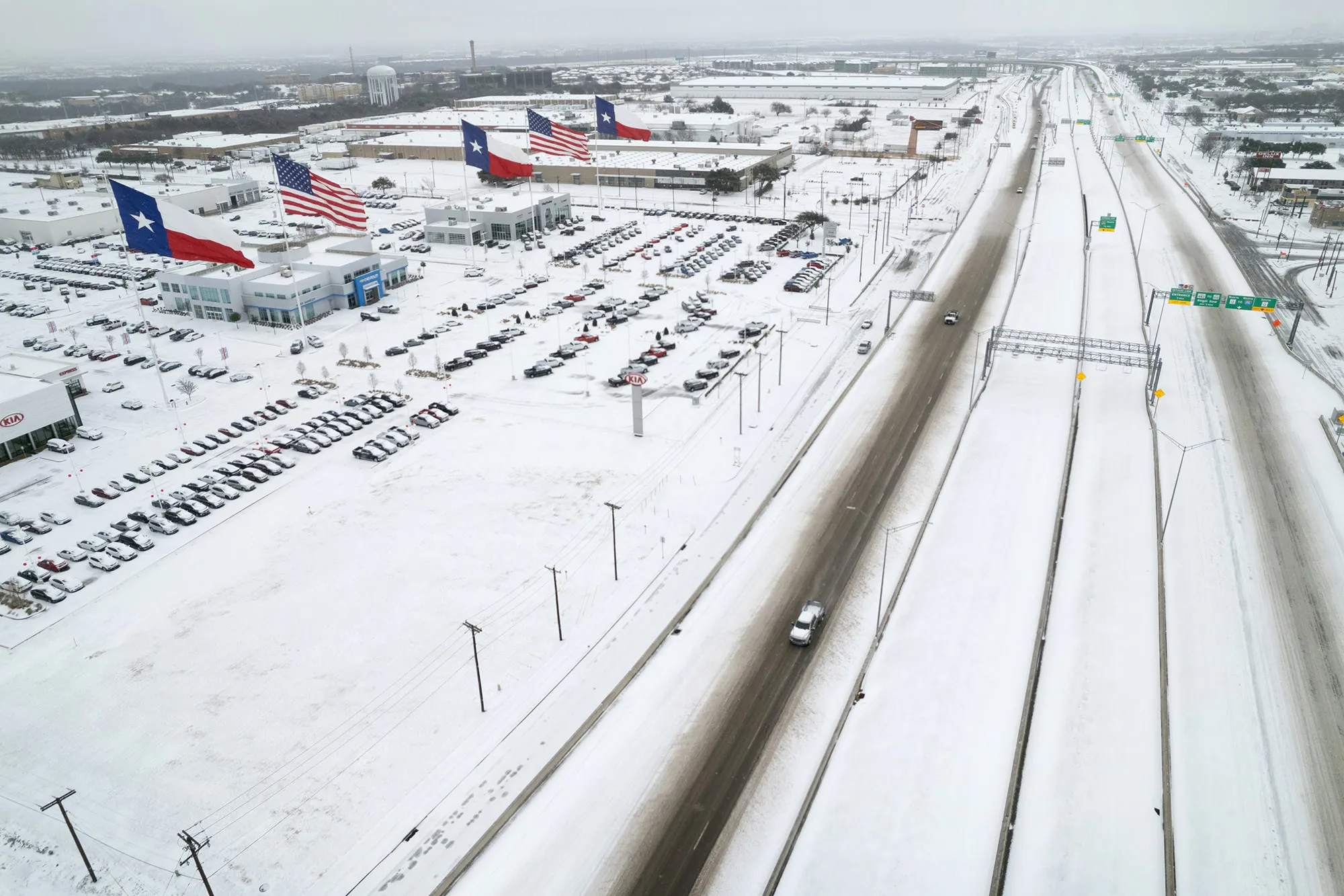 Traffic moves through snow and ice on U.S. Route 183 in Irving, Texas on Feb. 3.