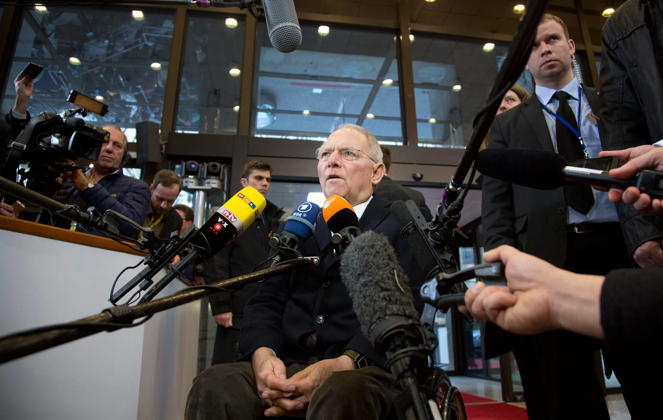 German Finance Minister Wolfgang Schaeuble speaks to the press as he arrives to attend an Eurogroup Finance ministers meeting at the European Council in Brussels, on Feb. 16, 2015.
