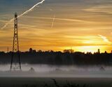 Pylons and misty sunrise with contrails - Lower Radley village