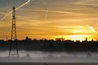 Pylons and misty sunrise with contrails - Lower Radley village