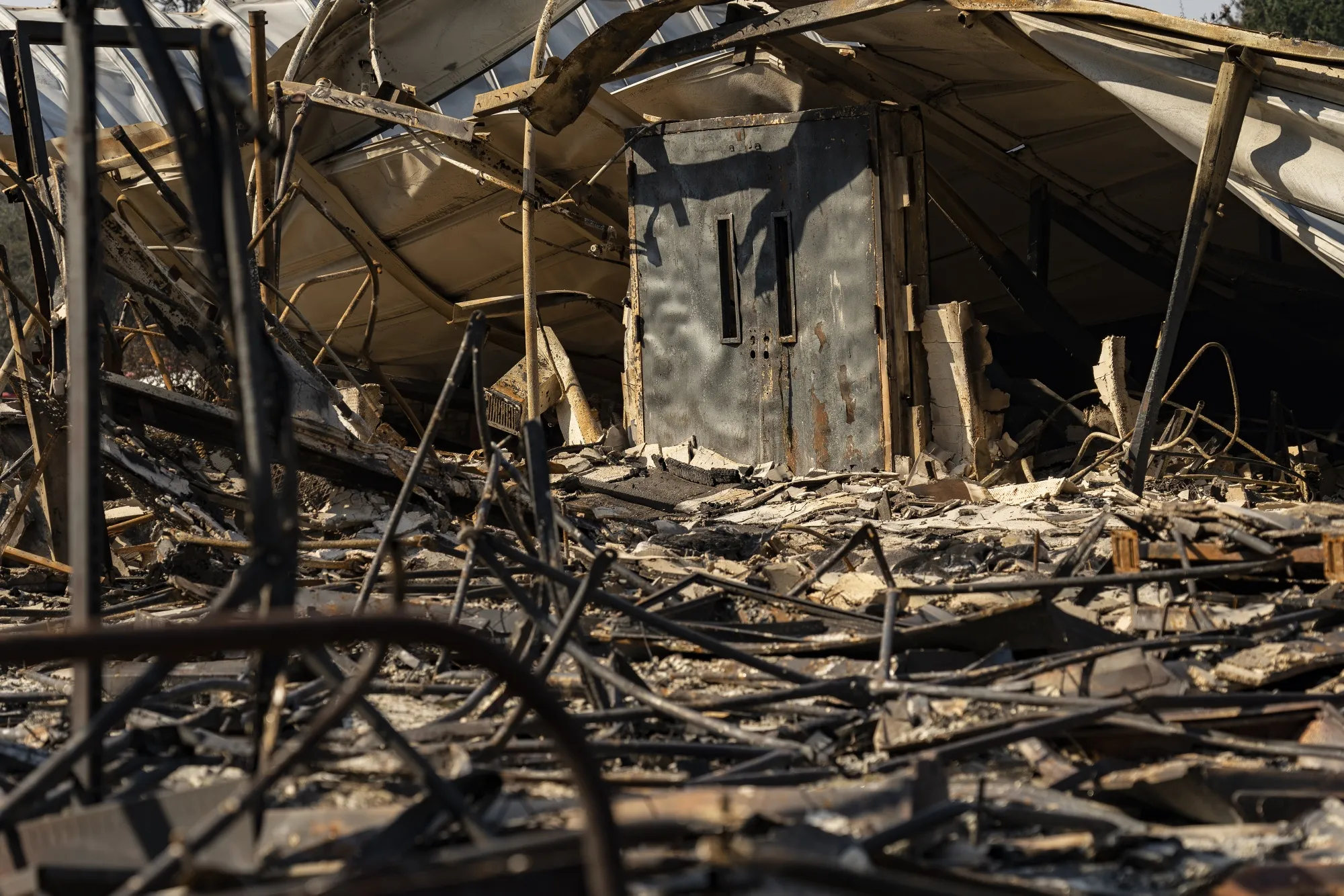 A door remains standing at Gates Elementary School destroyed by wildfires in Gates, Oregon, in September 2020.
