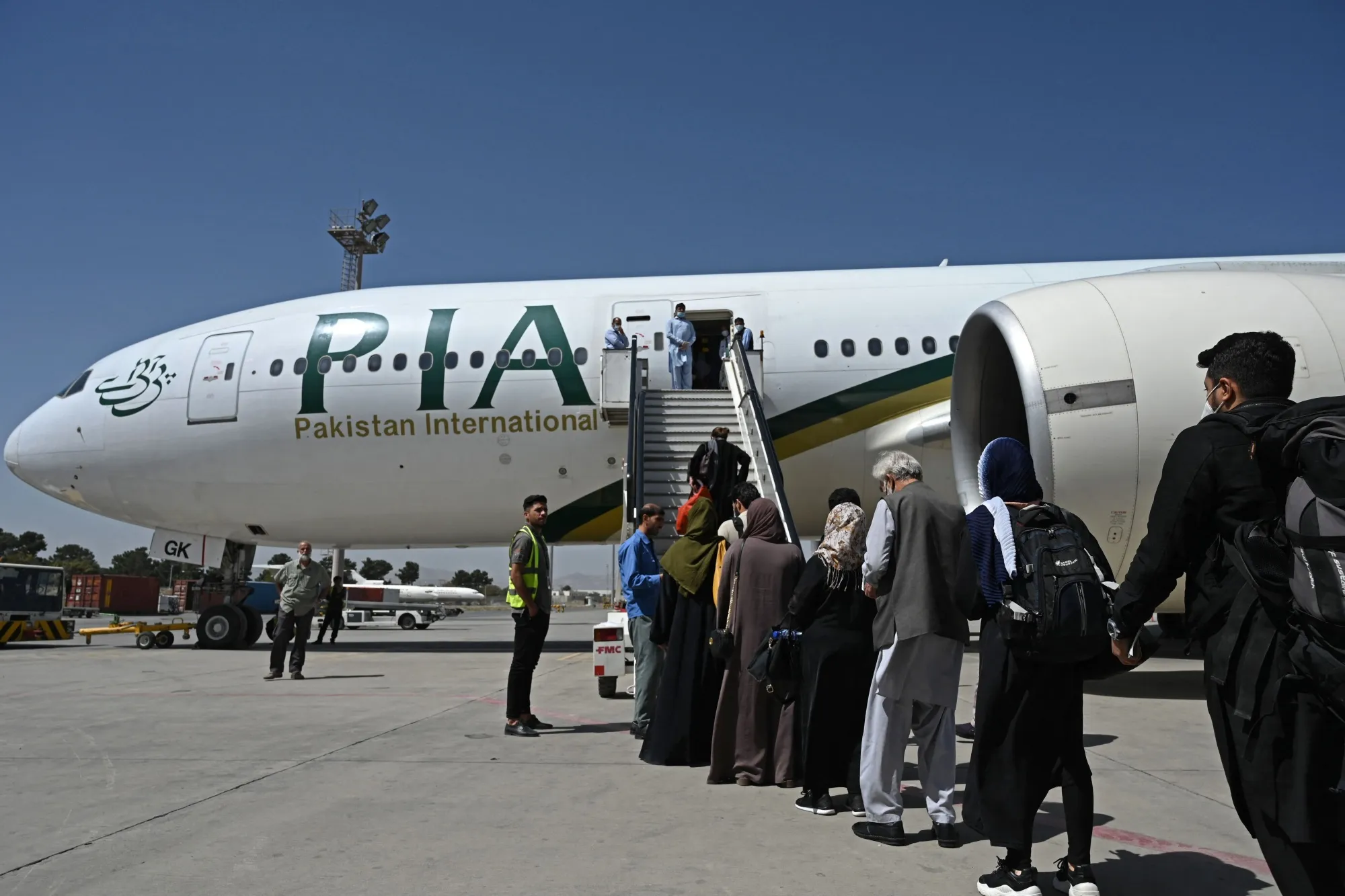 Passengers board a Pakistan International Airlines&nbsp;flight in Kabul.