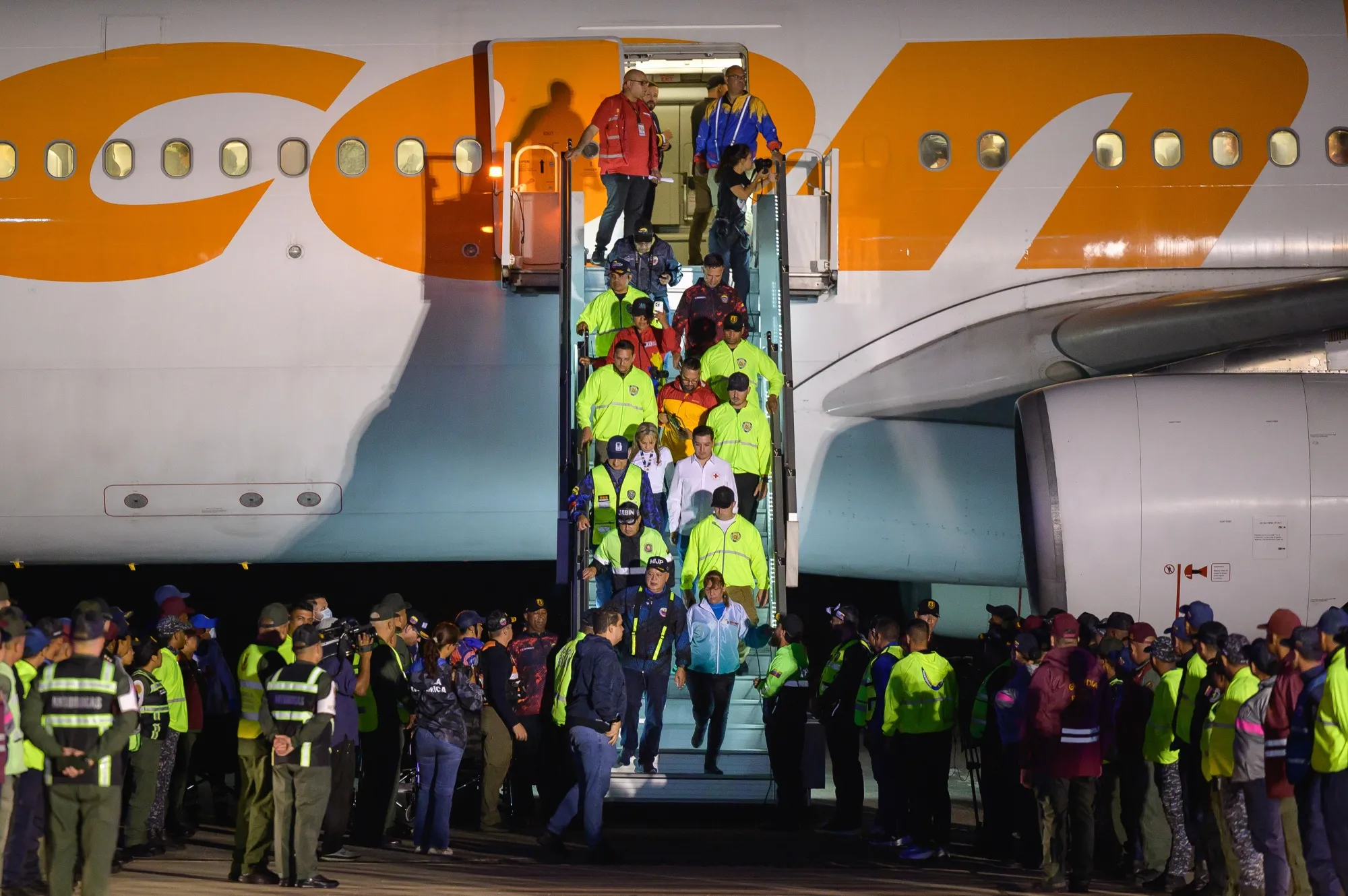 Deported individuals from the US exit an aircraft at Simon Bolivar International Airport in Maiquetia, Venezuela, on&nbsp;March 24.