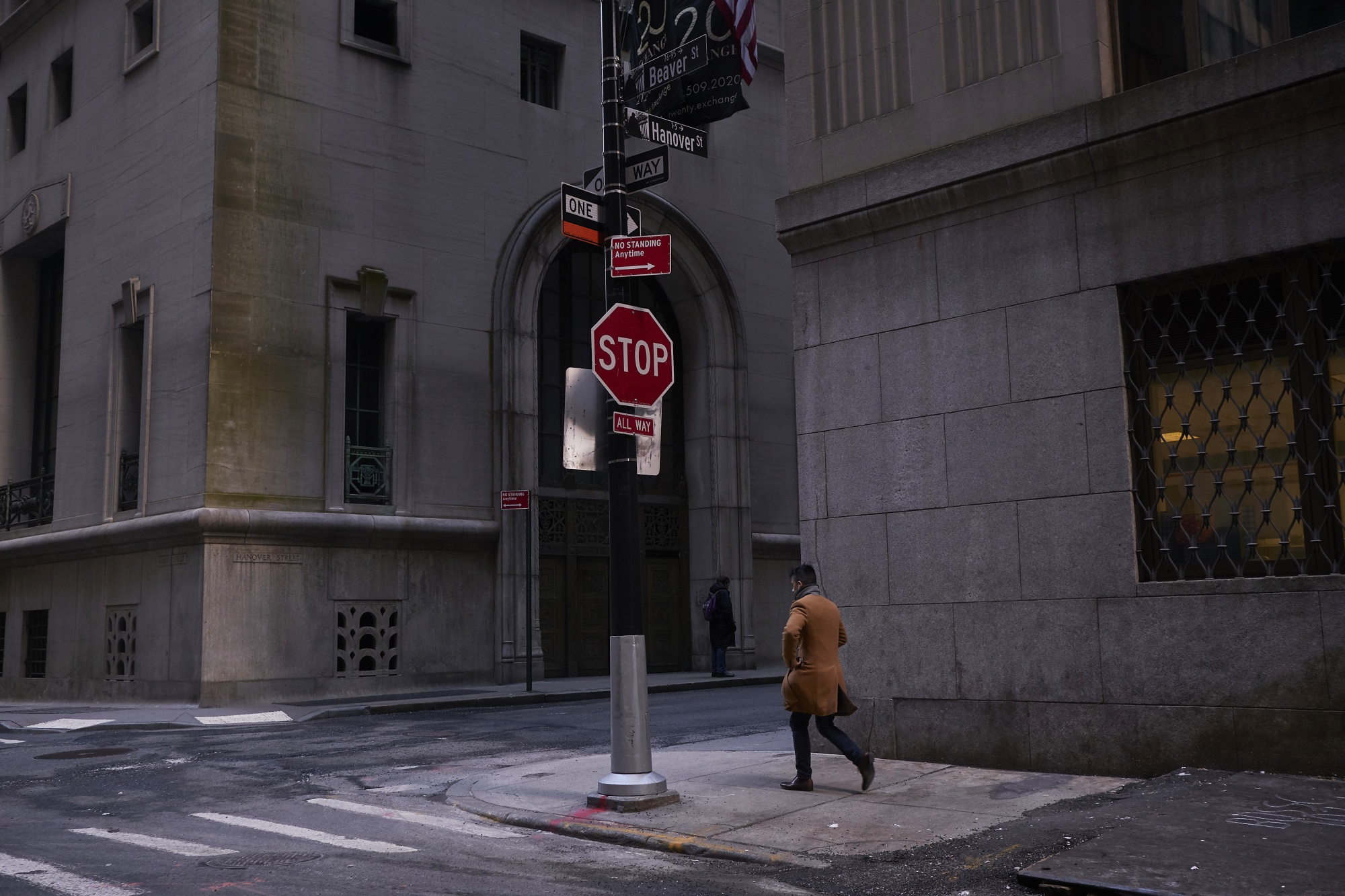 A pedestrian walks near Wall Street in New York.