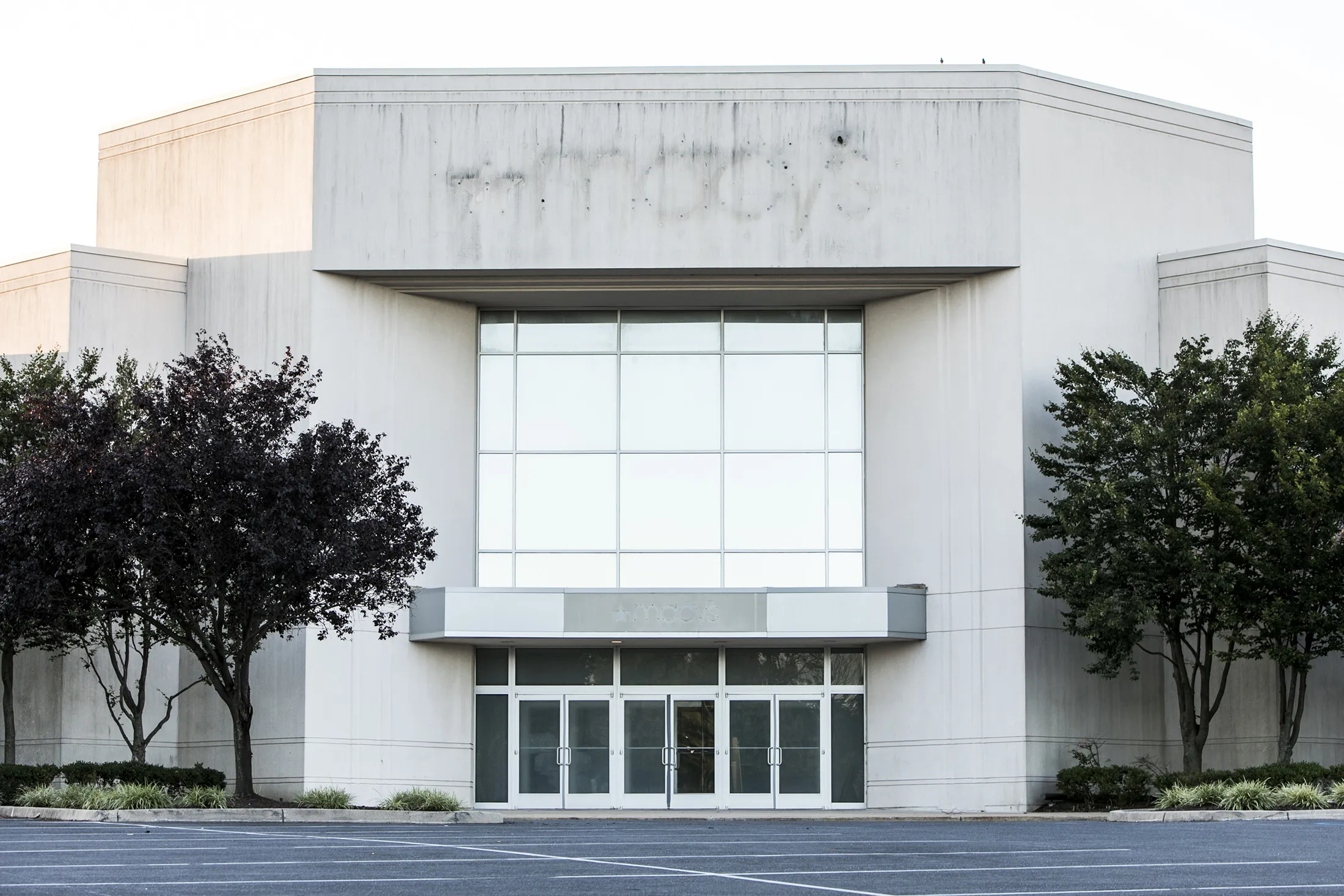 The outline of a Macy’s logo sign is seen on the outside of a now closed retail store location in Hagerstown, Maryland.