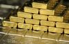One kilogram gold and silver bars sit arranged for a photograph at Oegussa GmbH, a unit of Umicore SA, in Vienna, Austria, on Friday, Jan. 16, 2015. The Swiss central bank's surprise move to abandon the franc's cap against the euro sent investors rushing to gold as a haven from swings in currencies.