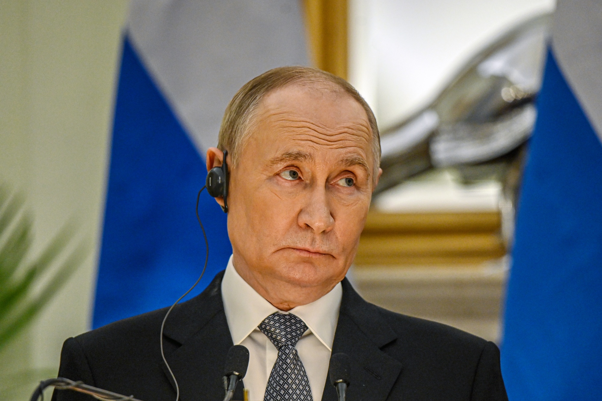 Vladimir Putin, Russia's president, during a news conference with Narendra Modi, India's prime minister, not pictured, at Hyderabad House in New Delhi, India, on Friday, Dec. 5, 2025. Modi and Putin held a bilateral meeting in New Delhi, as the two leaders look to deepen economic cooperation in the face of pressure from US President Donald Trump. Photographer: Prakash Singh/Bloomberg