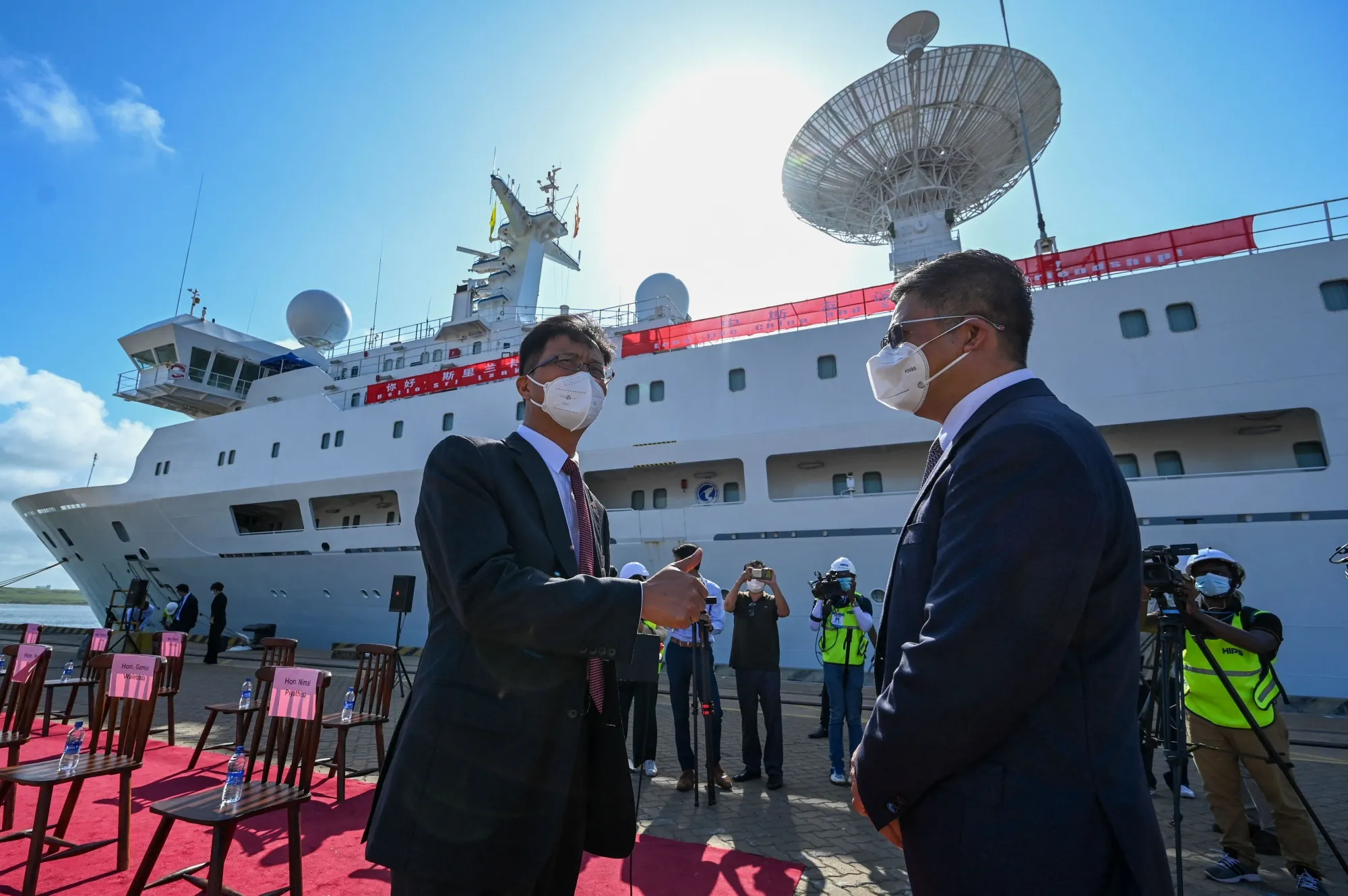 Chinese Ambassador to Sri Lanka, Qi Zhenhong, left,&nbsp;next to the research and survey vessel, the Yuan Wang 5 at Hambantota port on Aug. 16.