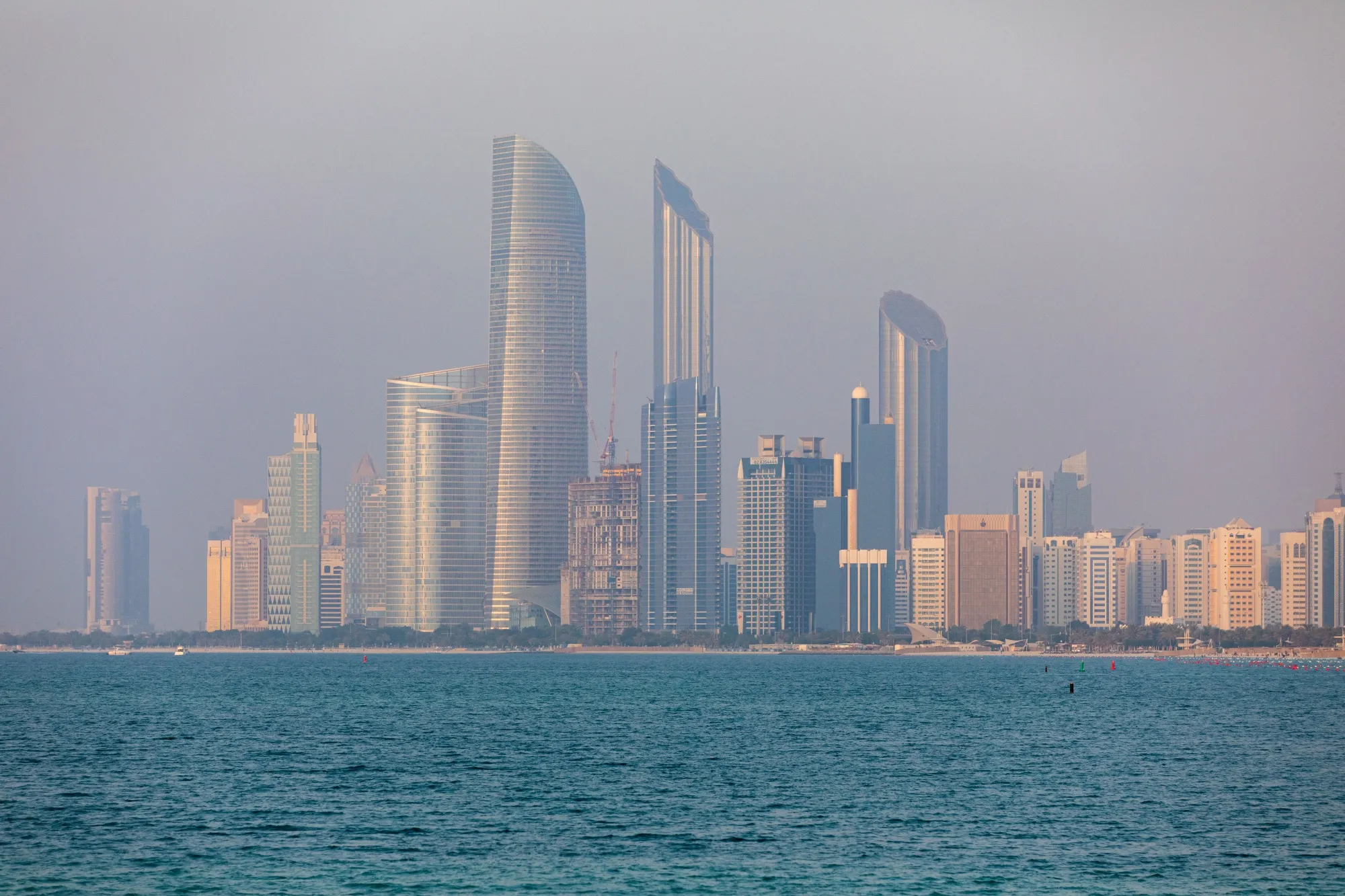 Commercial and residential skyscrapers stand along the coastline in Abu Dhabi, United Arab Emirates, on Wednesday, Oct. 2, 2019. Abu Dhabi sold $10 billion of bonds in a three-part deal in its first international offering in two years as it takes advantage of relatively low borrowing costs.