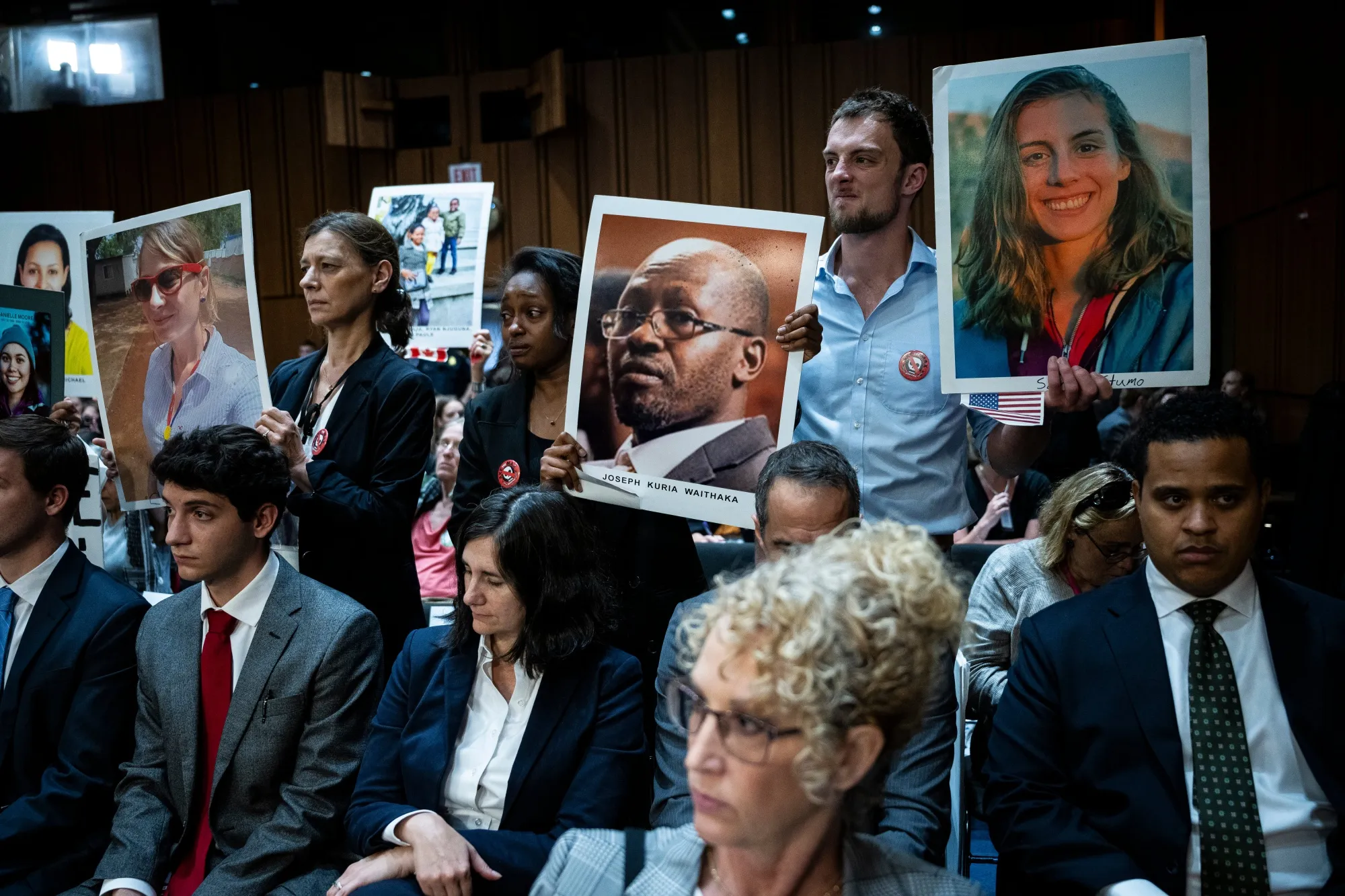 Relatives of Boeing Co. airplane crash victims hold images prior to a Senate&nbsp;hearing in Washington on&nbsp;June 18.