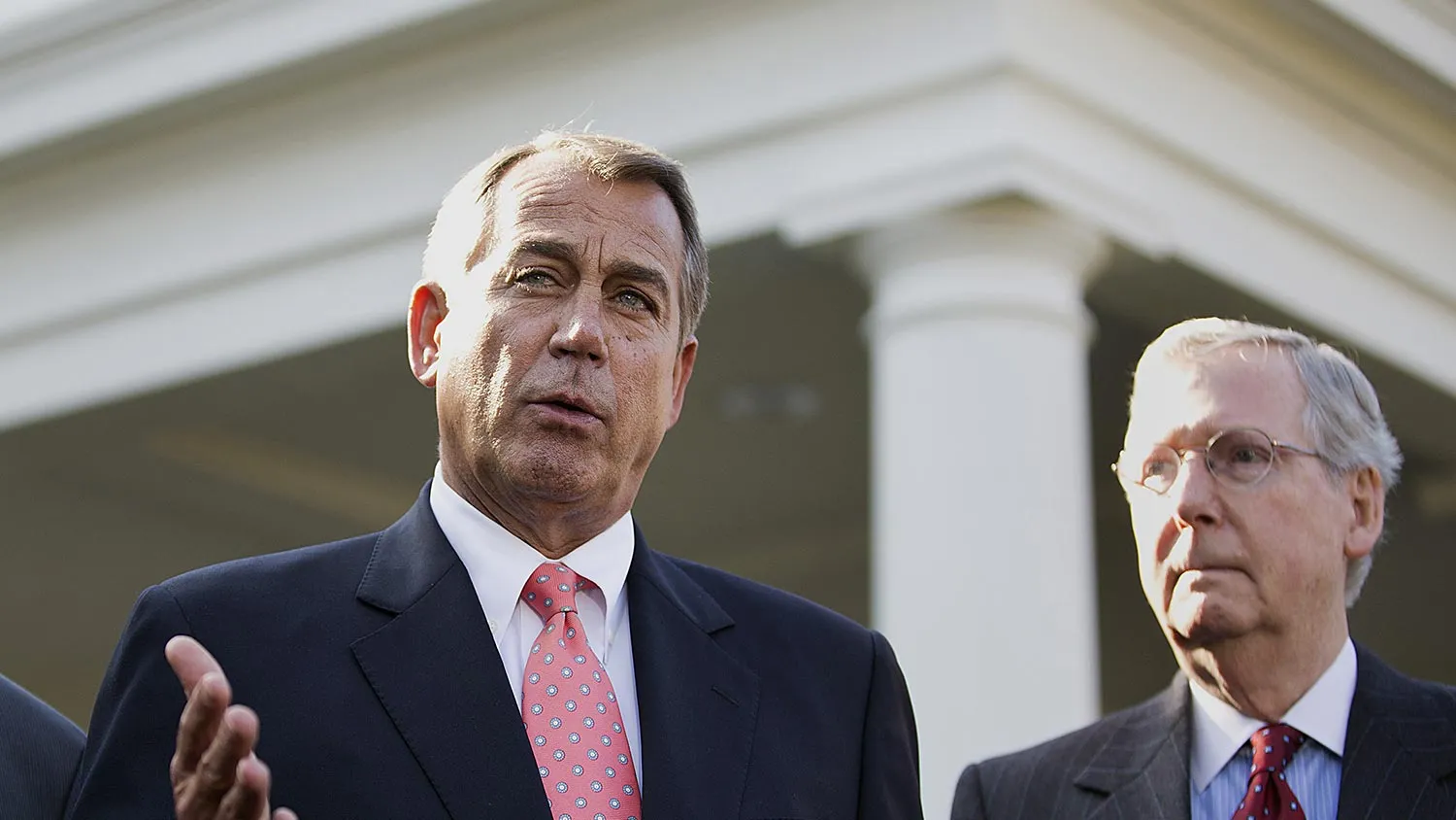 House Speaker John Boehner, a Republican from Ohio, center, speaks while Harry Reid, Democratic Senator from Nevada, left, and Mitch McConnell, Republican Senator from Kentucky, listen after meeting with U.S. President Barack Obama at the White House in Washington, D.C., U.S., on Friday, Nov. 16, 2012.
