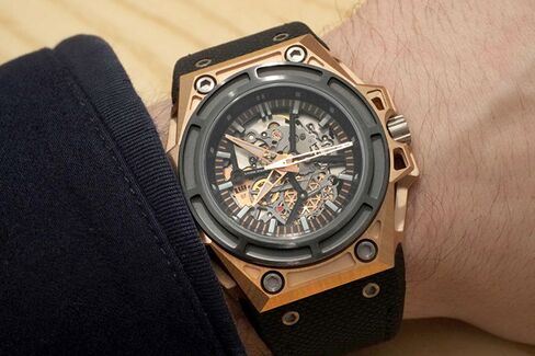 The solid gold SpidoLite has a black titanium bezel and case back.