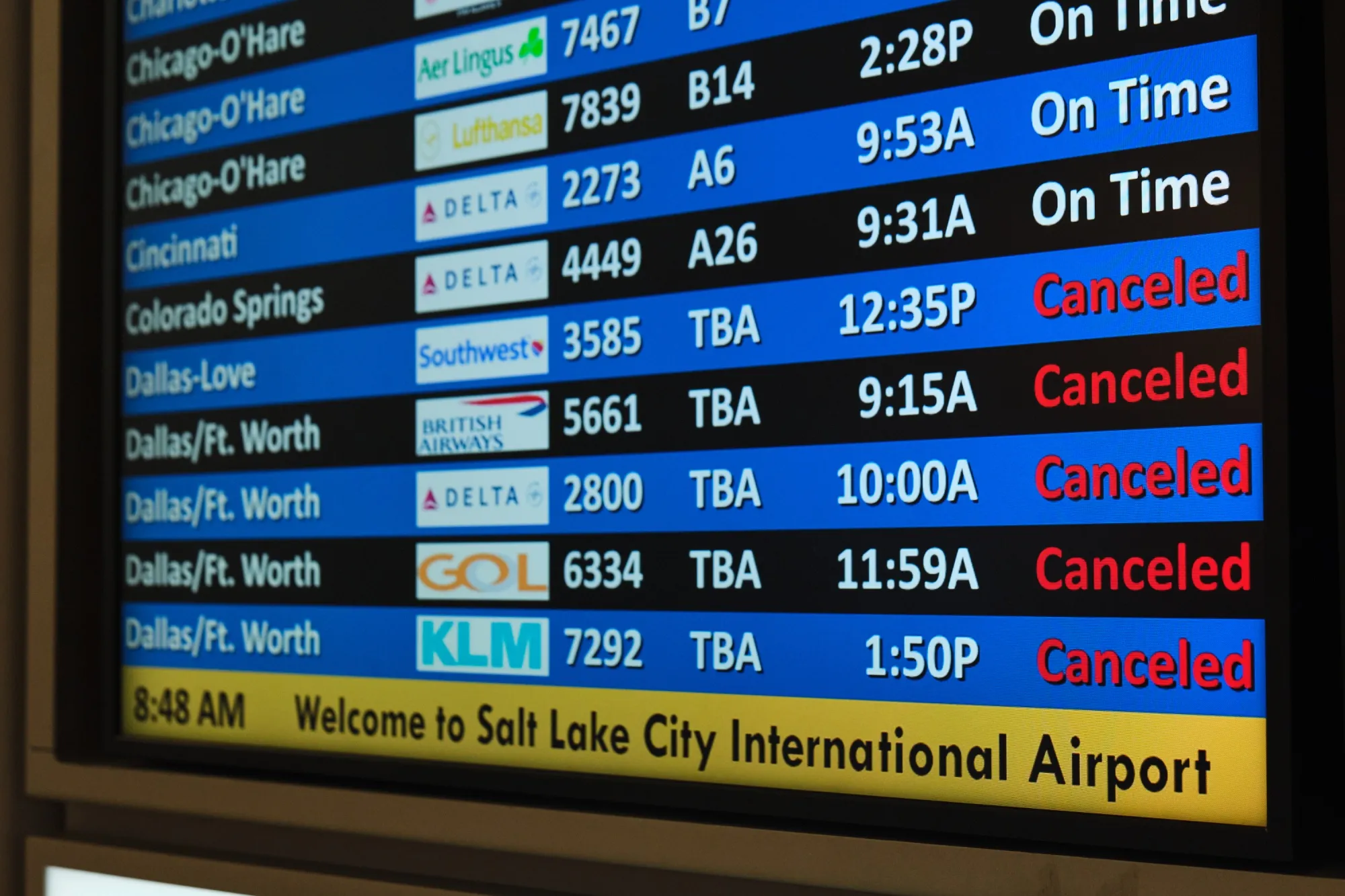 A flight status screen shows canceled flights to the Dallas-Fort Worth, Texas&nbsp;area from the Salt Lake City International Airport during&nbsp;a winter storm Jan. 24 in Salt Lake City.