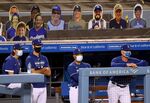 Dodgers players watch the final out of a game against the Arizona Diamondbacks&nbsp;in front of cutout fans&nbsp;at Dodger Stadium in Los Angeles on July 20.