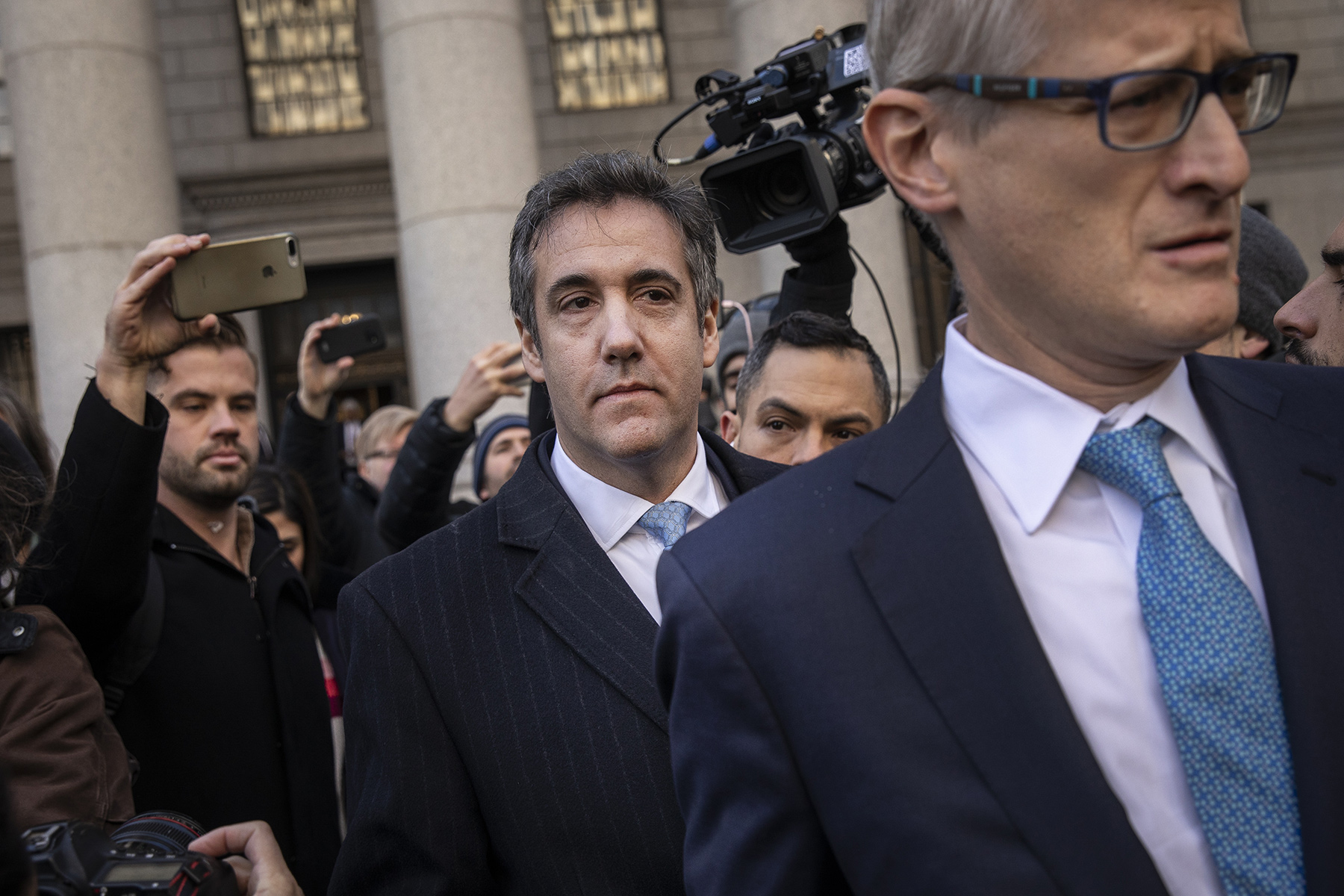 Michael Cohen exits federal court in New York on Nov. 29.