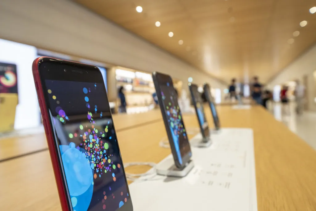 Apple Inc. iPhone smartphones sit on display at the company's Marina Bay Sands store ahead of its opening in Singapore, on Thursday, Sept. 10, 2020. Apple's shares have surged this year on rising demand of iPhones, iPads and other tech gear needed to work and study from home during the pandemic.