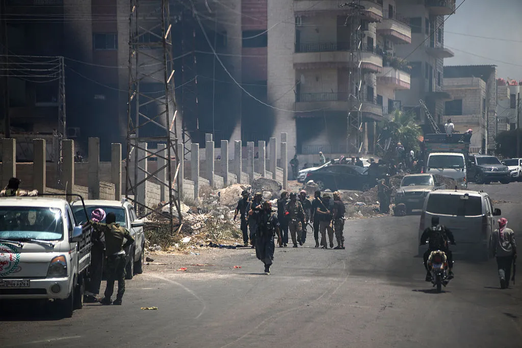 Tribal and bedouin fighters gather in Sweida, amid clashes with Druze gunmen on July 19.