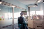A healthcare worker views a monitor inside the room at the Posta Central Emergency Hospital in Santiago, Chile.