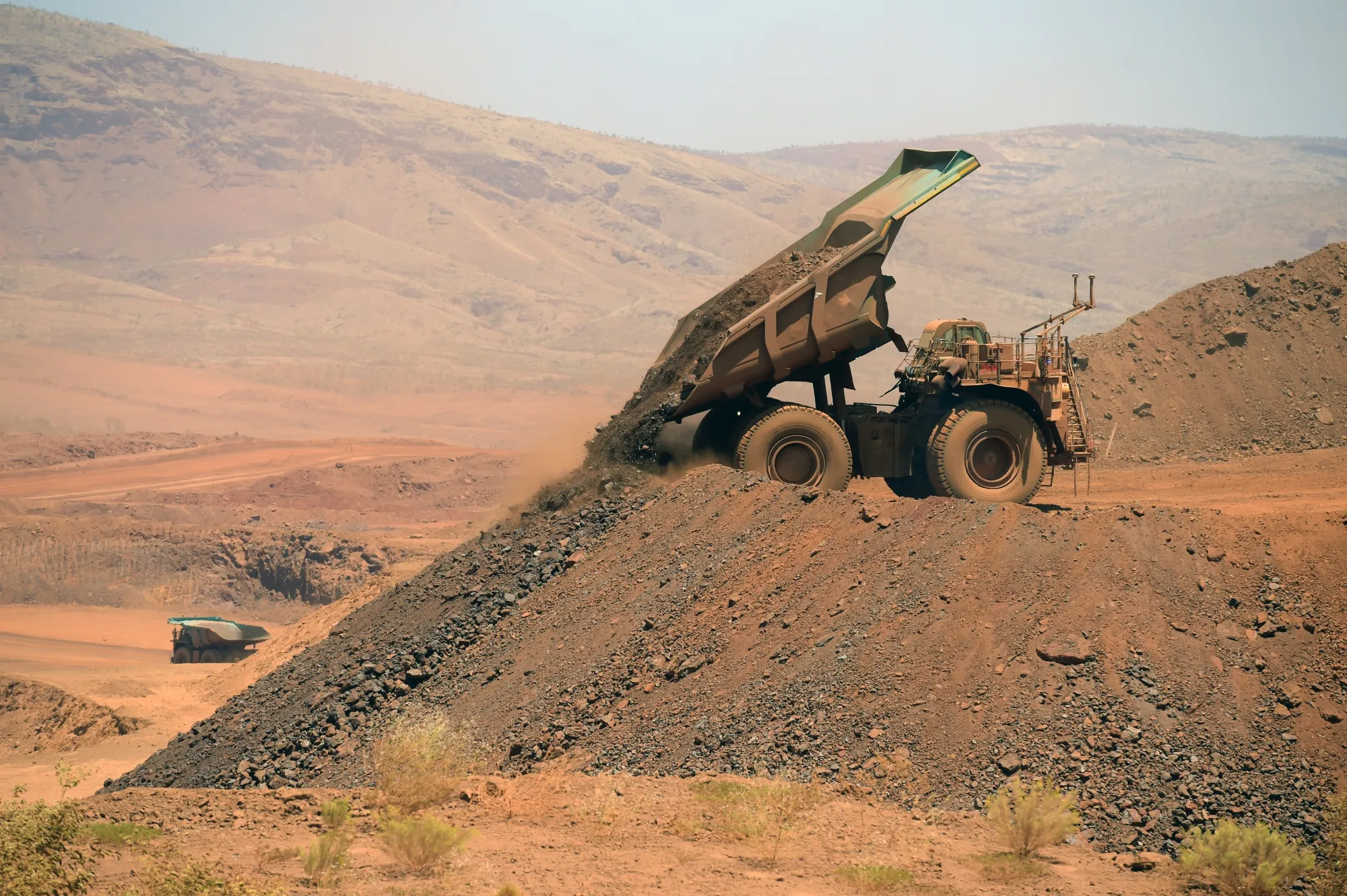 An autonomous haul truck dumps a load of rock in the mine pit at Rio Tinto Group's Gudai-Darri iron ore mine in the Pilbara region of Western Australia.&nbsp;
