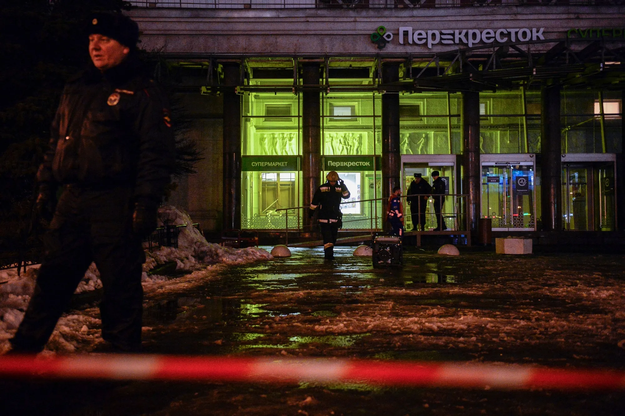 Firefighters and police officers work at the site of a blast in&nbsp;St. Petersburg on Dec. 27.