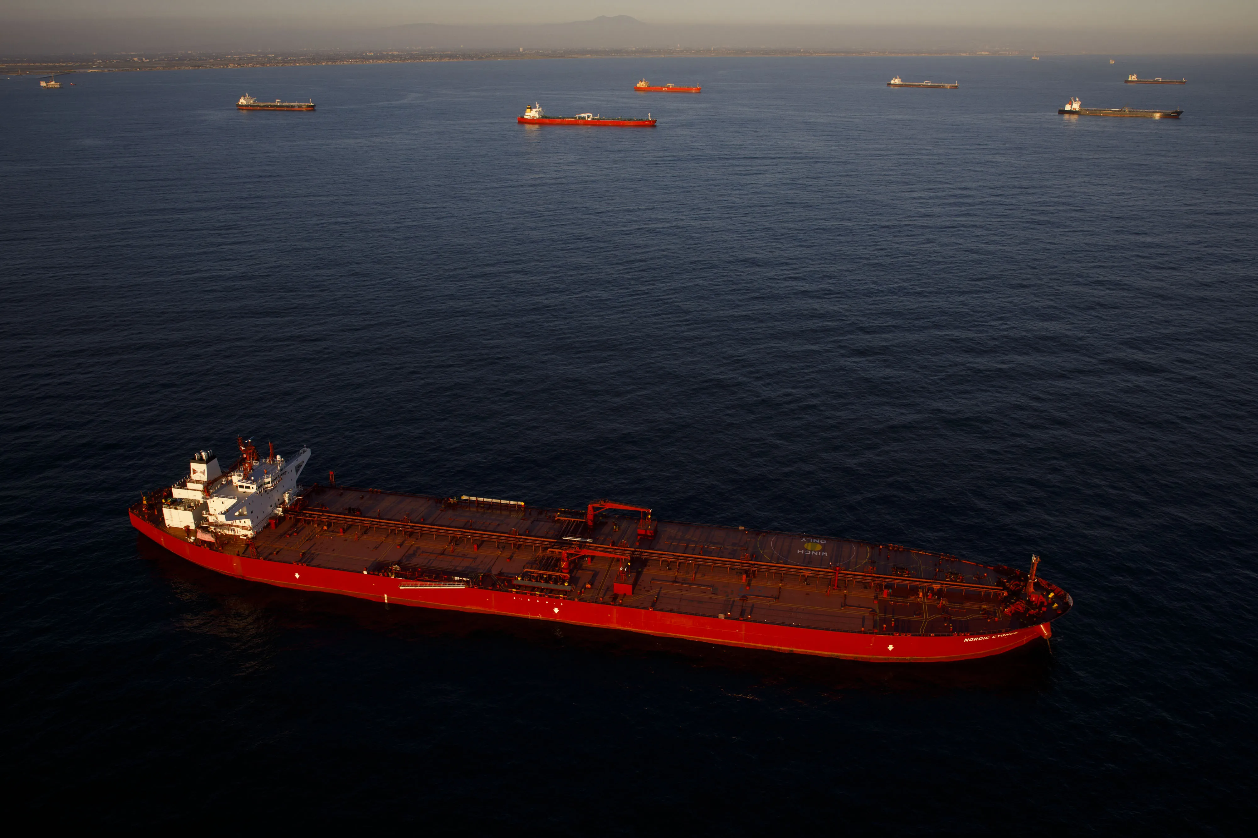 Anchored oil tankers.