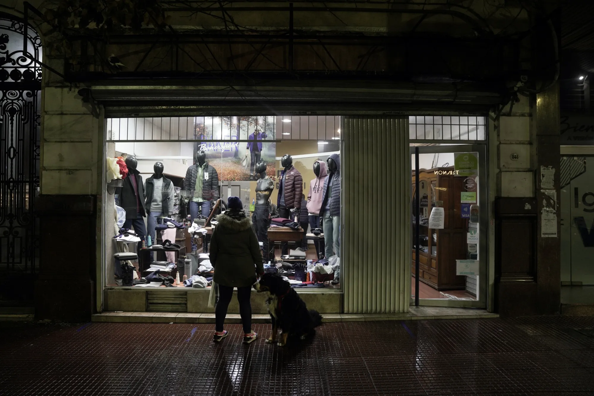 Men's clothing for sale in the window of a store in Buenos Aires, Argentina.