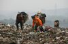 CHONGQING, CHINA - APRIL 2: (CHINA OUT) Scavengers pick up plastic bags at an open dump on April 2, 2008 in Chongqing Municipality, China. The Chinese government has announced a nationwide ban on stores distributing free ultra-thin plastic bags from June 1, 2008. The new rule says all retailers have to clearly indicate the price of their plastic bags and charge customers for the bags. Chinese people use up to three billion plastic bags a day, which caused about 5 million tonnes of crude oil used to make plastic bags for packaging every year, according to reports. (Photo by China Photos/Getty Images)