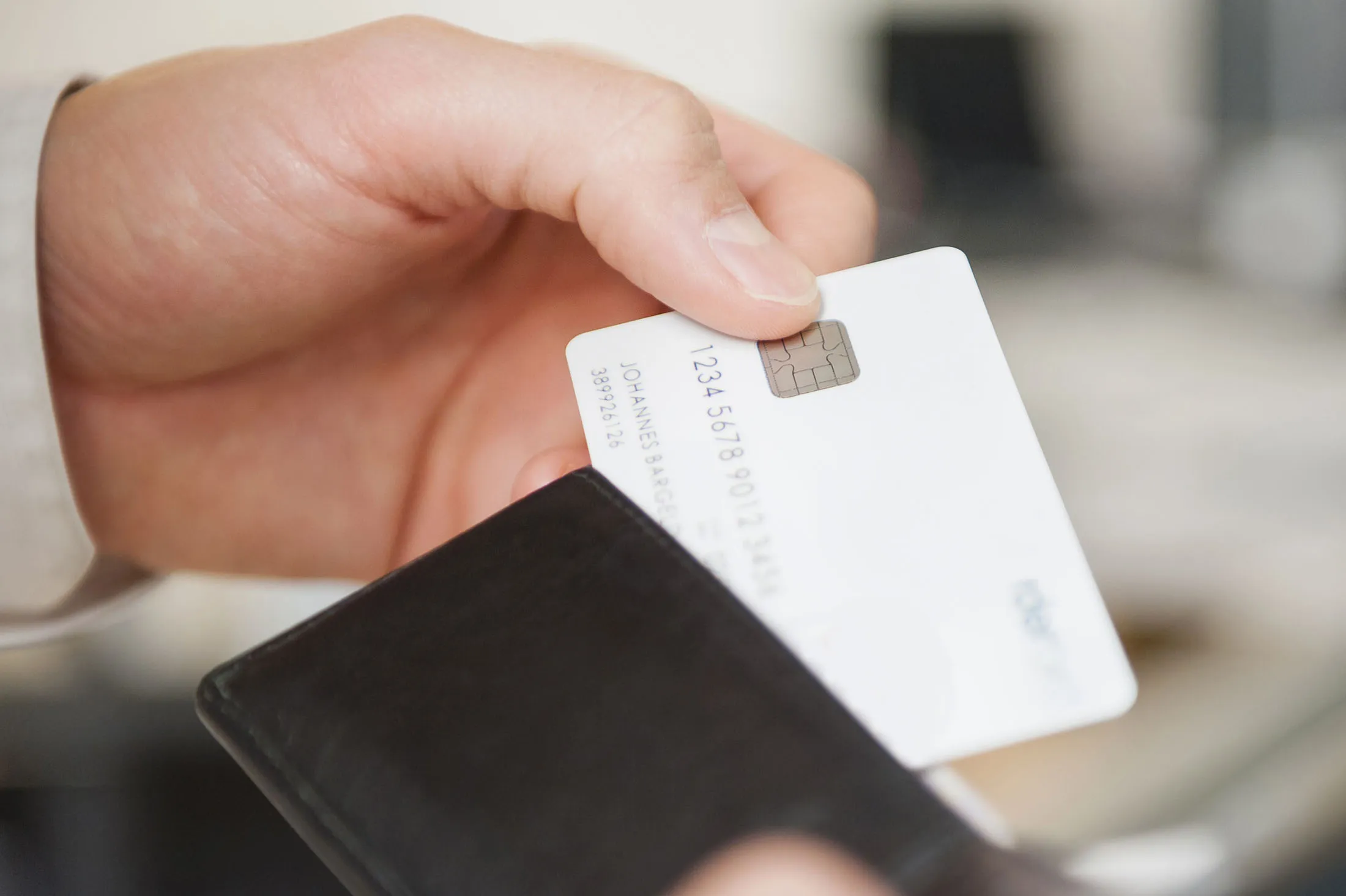 RF Credit card Hands of man holding wallet and blank white credit card