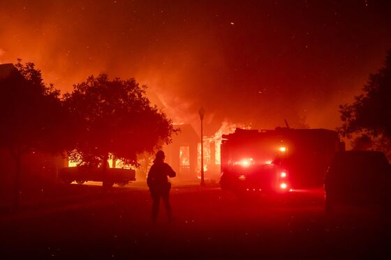 Death Toll Rises in California Blazes as High Winds Approach