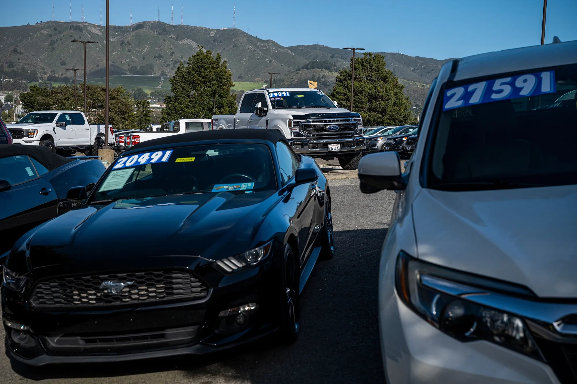Used vehicles for sale at a dealership in Colma, California.