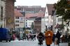Pedestrians wear protective face masks near retail outlets on Burgstrasse in Nuremburg, Germany, on Monday, Oct. 19, 2020.