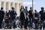 Representative&nbsp;Alexandria Ocasio-Cortez, center, is arrested&nbsp;outside the Supreme Court during an abortion-rights rally&nbsp;in Washington,&nbsp;on&nbsp;July 19.