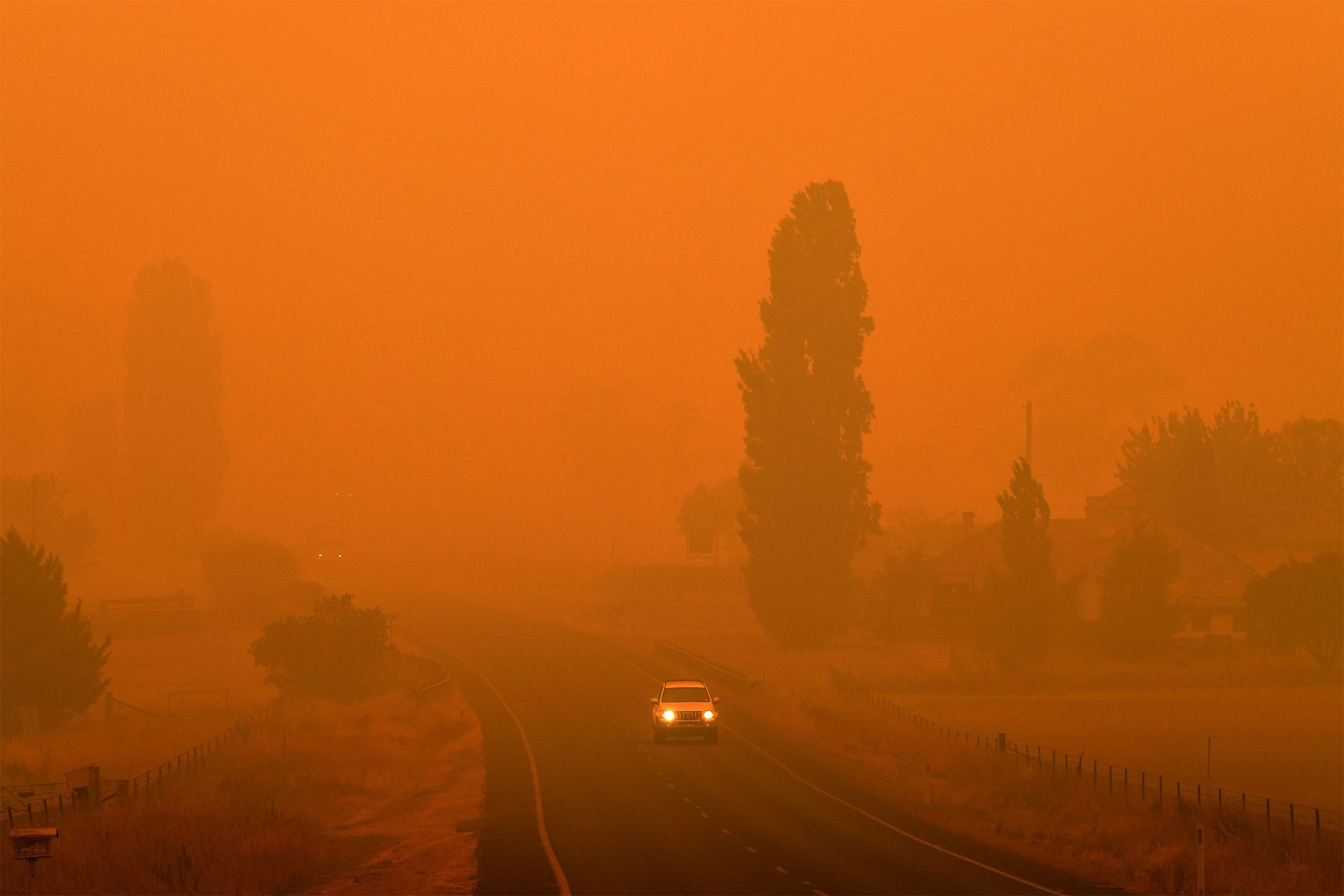 A car drives through thick smoke from bushfires in Bemboka, New South Wales,&nbsp;Australia, on Jan. 5.&nbsp;
