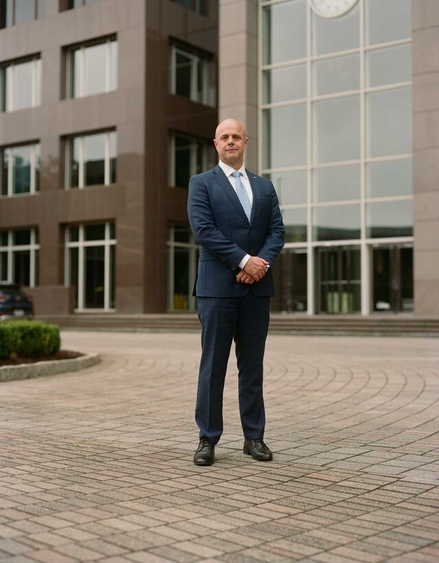 Reed, pictured standing in front of YKK’s corporate offices in Atlanta.