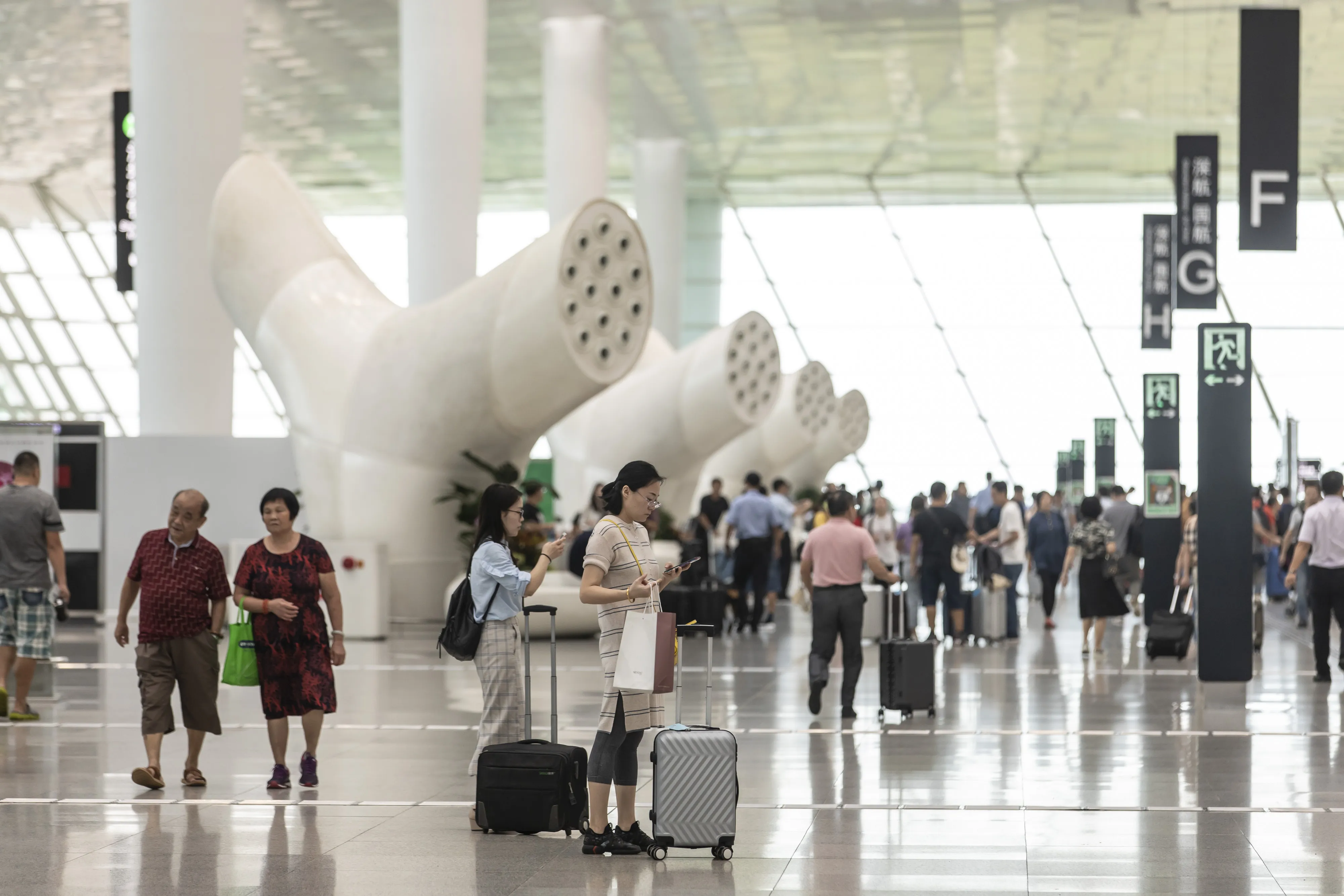 Travelers at Shenzhen Baoan International Airport in Shenzhen, China.&nbsp;